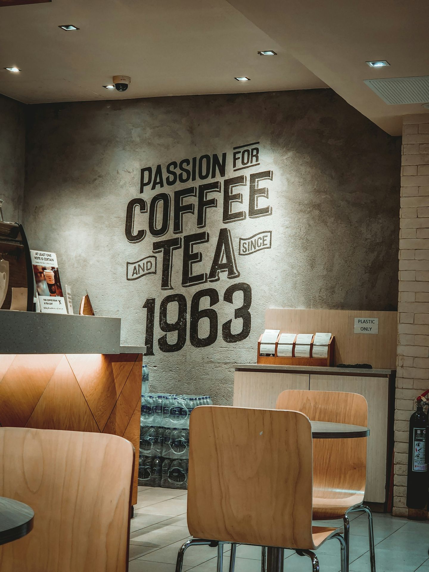 Stylish reception signage with a vintage coffee-themed design on a wall.